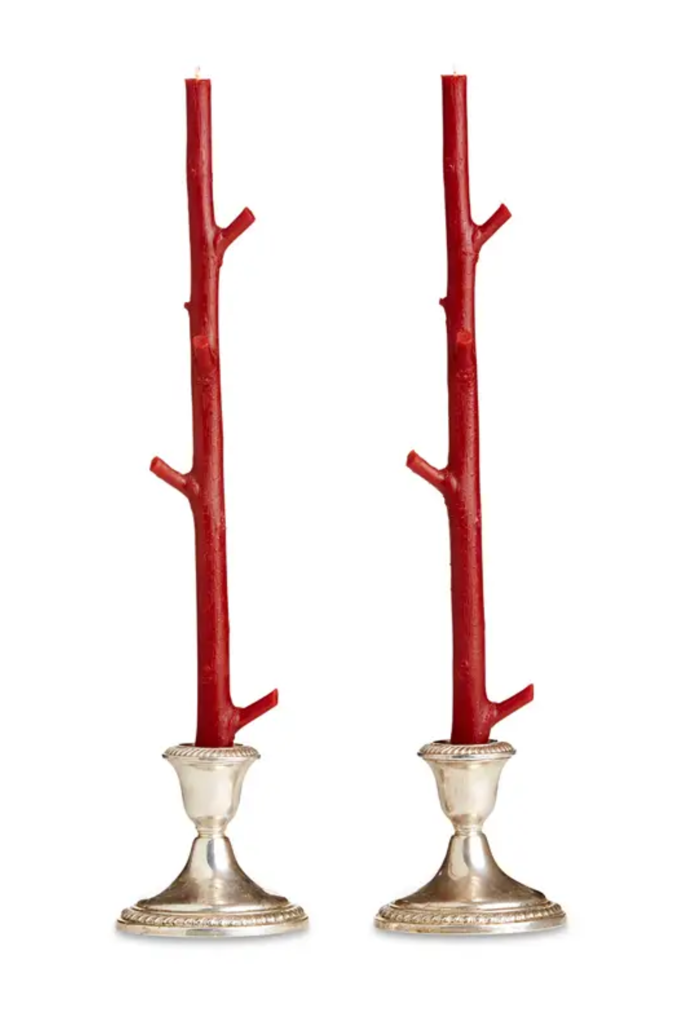 Two red branch-like candle tapers with silver bases on a white background