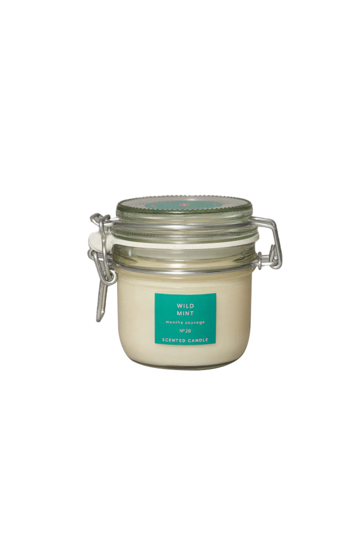 A medium-sized clear glass jar with a clip top lid containing a wild mint candle, labeled with the brand True Grace.