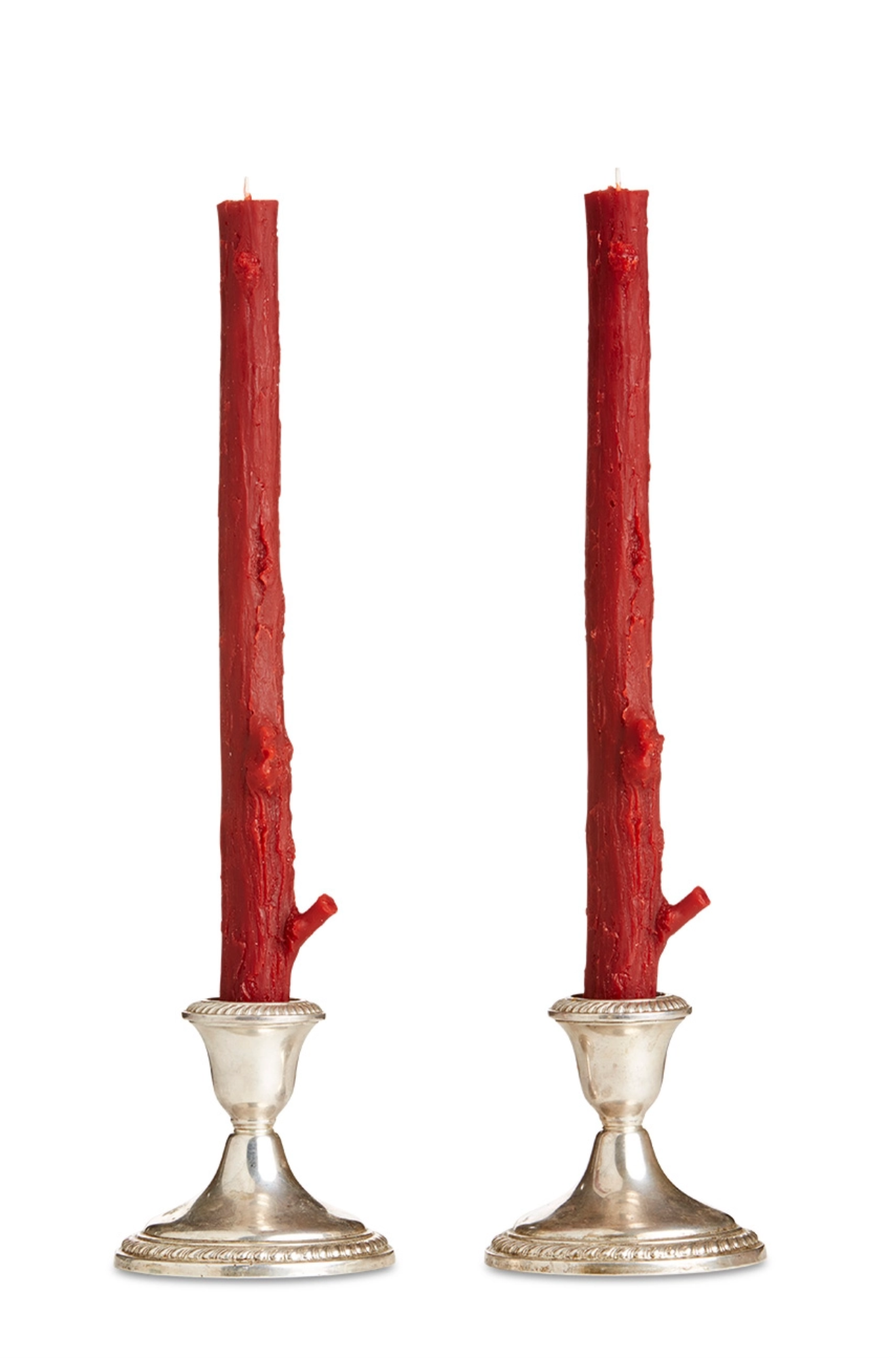 Two red  branch candles in silver candle holders on a white background